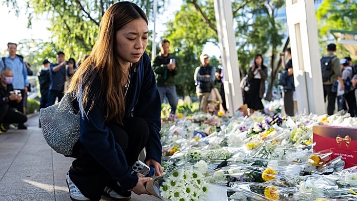 Ezrek rótták le kegyeletüket a hongkongi tűzvész áldozatainak emléke előtt